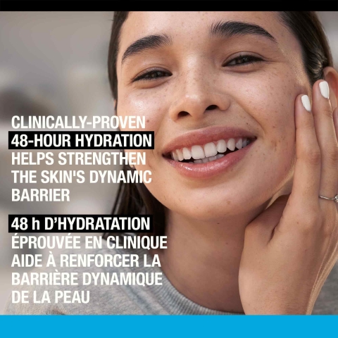 Woman touching her skin and smiling with a text stating, 'Clinically Proven 48-Hour Hydration'